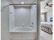 Clean bathroom with a shower/tub combo and updated fixtures at 4950 Pond Ridge Dr, Riverview, FL 33578