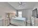 Light and airy bedroom with a double bed, dresser, and ceiling fan at 4950 Pond Ridge Dr, Riverview, FL 33578