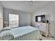 Bedroom with a double bed, dresser, and ceiling fan at 4950 Pond Ridge Dr, Riverview, FL 33578