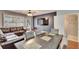 Spacious dining area with dark wood table and leather sofa at 4950 Pond Ridge Dr, Riverview, FL 33578