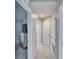 Upstairs hallway with carpet and access to bedrooms at 4950 Pond Ridge Dr, Riverview, FL 33578
