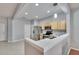 Modern kitchen with stainless steel appliances and light wood cabinets at 4950 Pond Ridge Dr, Riverview, FL 33578