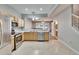 Modern kitchen with stainless steel appliances and light wood cabinets at 4950 Pond Ridge Dr, Riverview, FL 33578