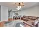 Spacious living room featuring a brown sectional sofa and ceiling fan at 4950 Pond Ridge Dr, Riverview, FL 33578
