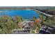 Community pool near lake; serene waterfront setting at 4950 Pond Ridge Dr, Riverview, FL 33578