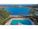 Community pool with lake view; resort-style living at 4950 Pond Ridge Dr, Riverview, FL 33578