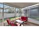 Screened patio furniture with glass-top table at 4950 Pond Ridge Dr, Riverview, FL 33578