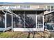 Screened porch on townhouse with AC unit at 4950 Pond Ridge Dr, Riverview, FL 33578