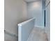 Upstairs hallway with neutral paint and carpet at 4950 Pond Ridge Dr, Riverview, FL 33578