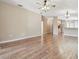 Spacious living room featuring hardwood floors and ceiling fan at 6109 Gentle Ben Cir, Wesley Chapel, FL 33544