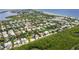 Aerial view of canal-front homes and beach access at 616 Lyons Ln, Longboat Key, FL 34228