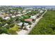Aerial view of waterfront homes and lush tropical landscape at 616 Lyons Ln, Longboat Key, FL 34228