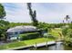 Single-story home with private pool and dock access at 616 Lyons Ln, Longboat Key, FL 34228