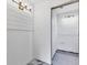 Simple bathroom with white shiplap walls and new flooring at 616 Lyons Ln, Longboat Key, FL 34228