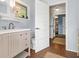 Bathroom with vanity, toilet, and laundry room access at 616 Lyons Ln, Longboat Key, FL 34228