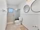 Clean bathroom featuring a walk-in shower and updated fixtures at 616 Lyons Ln, Longboat Key, FL 34228
