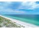 Stunning beachfront view with white sand and clear water at 616 Lyons Ln, Longboat Key, FL 34228