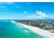 Aerial view of beach, coastline, and neighborhood at 616 Lyons Ln, Longboat Key, FL 34228
