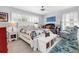 Bright bedroom with a comfortable queen-size bed and access to a private deck at 616 Lyons Ln, Longboat Key, FL 34228