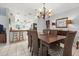 Open dining area, showcasing a view into a well-lit kitchen at 616 Lyons Ln, Longboat Key, FL 34228