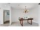 Empty dining room with tiled floor and a unique chandelier at 616 Lyons Ln, Longboat Key, FL 34228