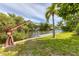 Private dock with boat lift and lush landscaping at 616 Lyons Ln, Longboat Key, FL 34228