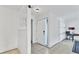 Simple entryway with tiled floors and brick accent wall at 616 Lyons Ln, Longboat Key, FL 34228