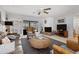 Relaxing living room with fireplace and view of pool at 616 Lyons Ln, Longboat Key, FL 34228