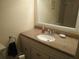Bathroom with vanity and a large mirror at 6177 Chesham Dr # 6, New Port Richey, FL 34653