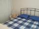Bedroom with double bed, closet and wicker chair at 6177 Chesham Dr # 6, New Port Richey, FL 34653