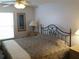 Main bedroom with a queen-size bed, nightstands, and ceiling fan at 6177 Chesham Dr # 6, New Port Richey, FL 34653