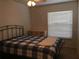 Bedroom with double bed and dresser at 6177 Chesham Dr # 6, New Port Richey, FL 34653