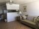 Kitchen with light cabinets, a breakfast bar, and tiled floor at 6177 Chesham Dr # 6, New Port Richey, FL 34653