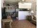 Open concept kitchen and living area, with a breakfast bar at 6177 Chesham Dr # 6, New Port Richey, FL 34653