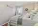 Charming bedroom with striped bedding and a white dresser at 7318 Filbert Ln, Tampa, FL 33637