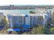 Aerial view of a condo building with parking and waterfront access at 7902 Sailboat Key S Blvd # 405, South Pasadena, FL 33707