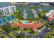 Aerial view showing pool, tennis courts, and marina at 7902 Sailboat Key S Blvd # 405, South Pasadena, FL 33707