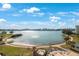 Aerial view of waterfront property with a community pool and lush landscaping at 7902 Sailboat Key S Blvd # 405, South Pasadena, FL 33707