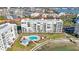 Aerial view of condo building with pool and waterfront access at 7902 Sailboat Key S Blvd # 405, South Pasadena, FL 33707