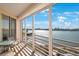 Spacious balcony with stunning waterfront views and seating area at 7902 Sailboat Key S Blvd # 405, South Pasadena, FL 33707