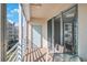 Private balcony with sliding glass doors and seating at 7902 Sailboat Key S Blvd # 405, South Pasadena, FL 33707