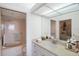 Bathroom with bathtub, vanity, and walk-in closet at 7902 Sailboat Key S Blvd # 405, South Pasadena, FL 33707