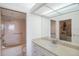 Bathroom with bathtub, vanity, and walk-in closet at 7902 Sailboat Key S Blvd # 405, South Pasadena, FL 33707