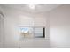 Bright bedroom with corner window and white walls at 7902 Sailboat Key S Blvd # 405, South Pasadena, FL 33707