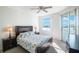 Bedroom with water views, ceiling fan, and dresser at 7902 Sailboat Key S Blvd # 405, South Pasadena, FL 33707