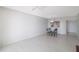 Bright dining area with glass table and four chairs, tile flooring at 7902 Sailboat Key S Blvd # 405, South Pasadena, FL 33707