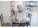 Bright dining area with glass table and chairs, water view at 7902 Sailboat Key S Blvd # 405, South Pasadena, FL 33707