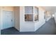 Building hallway with light-grey door and bay window at 7902 Sailboat Key S Blvd # 405, South Pasadena, FL 33707