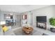 Bright living room with water view, comfy seating, and modern TV stand at 7902 Sailboat Key S Blvd # 405, South Pasadena, FL 33707