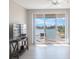 Living room with sliding doors leading to a balcony and water views at 7902 Sailboat Key S Blvd # 405, South Pasadena, FL 33707